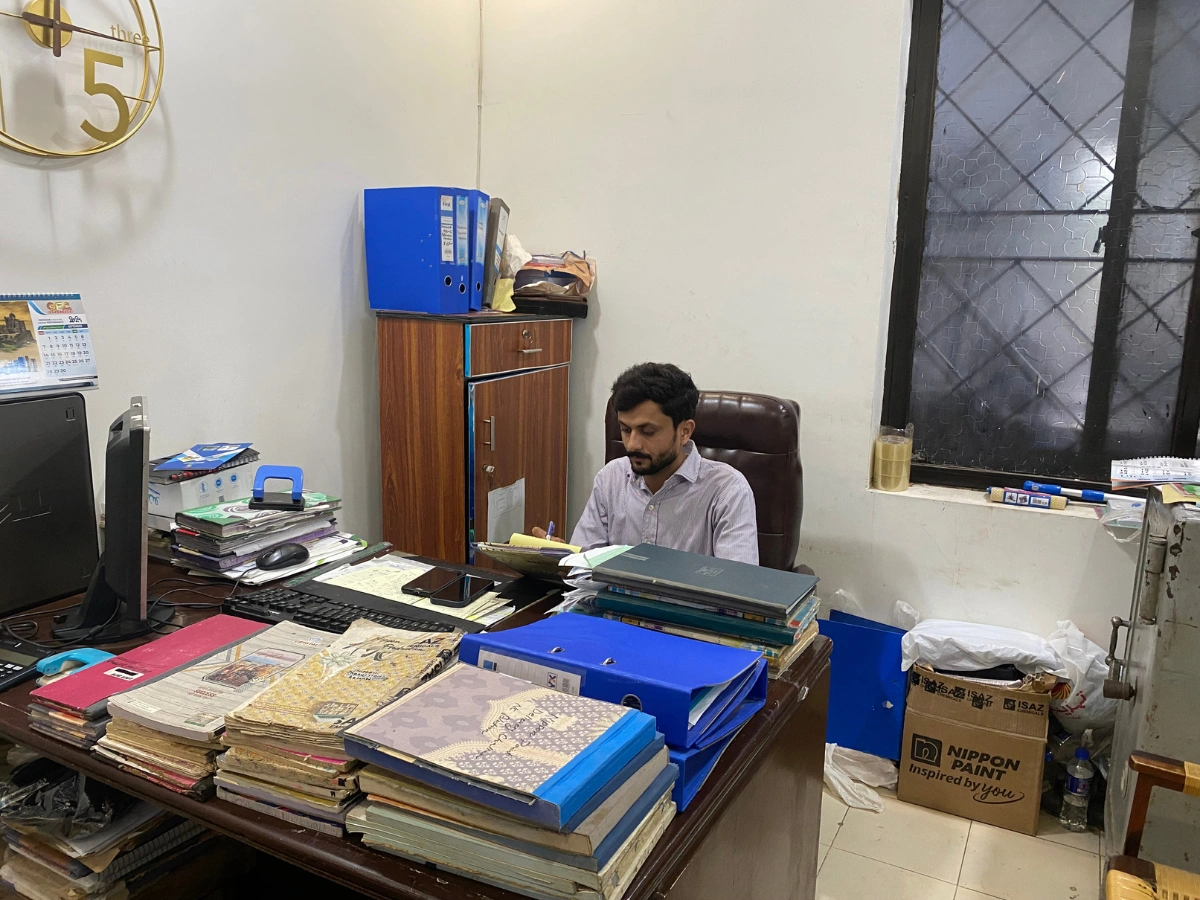 Office staff managing production records for Toll Manufacturing for startups in Pakistan.